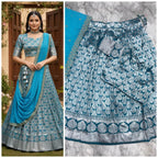 Exquisite Silver Zari work on a classic Teal Silk Lehenga