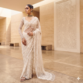 A timeless maroon masterpiece with intricate gold mirror-work and a coordinating full-sleeved blouse.