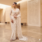 A timeless maroon masterpiece with intricate gold mirror-work and a coordinating full-sleeved blouse.