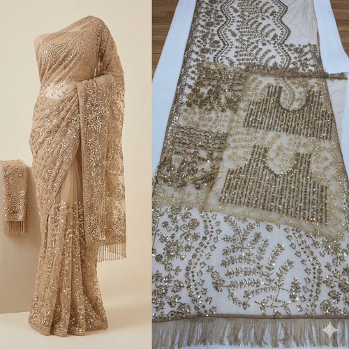 A luxurious ochre gold net saree adorned with dense floral embroidery