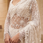 A timeless maroon masterpiece with intricate gold mirror-work and a coordinating full-sleeved blouse.