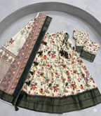 Cream Floral Kalamkari Pattu Half Saree Set with Rich Wine-Purple Borders and Tassels