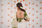 Elegance in Tradition Minimalist White and Olive Green Handloom Saree